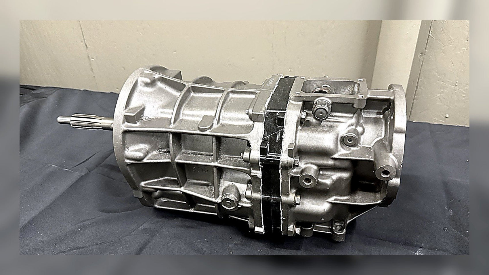 AX15 transmission guide showcasing a detailed view of an AX15 gearbox on a dark surface.
