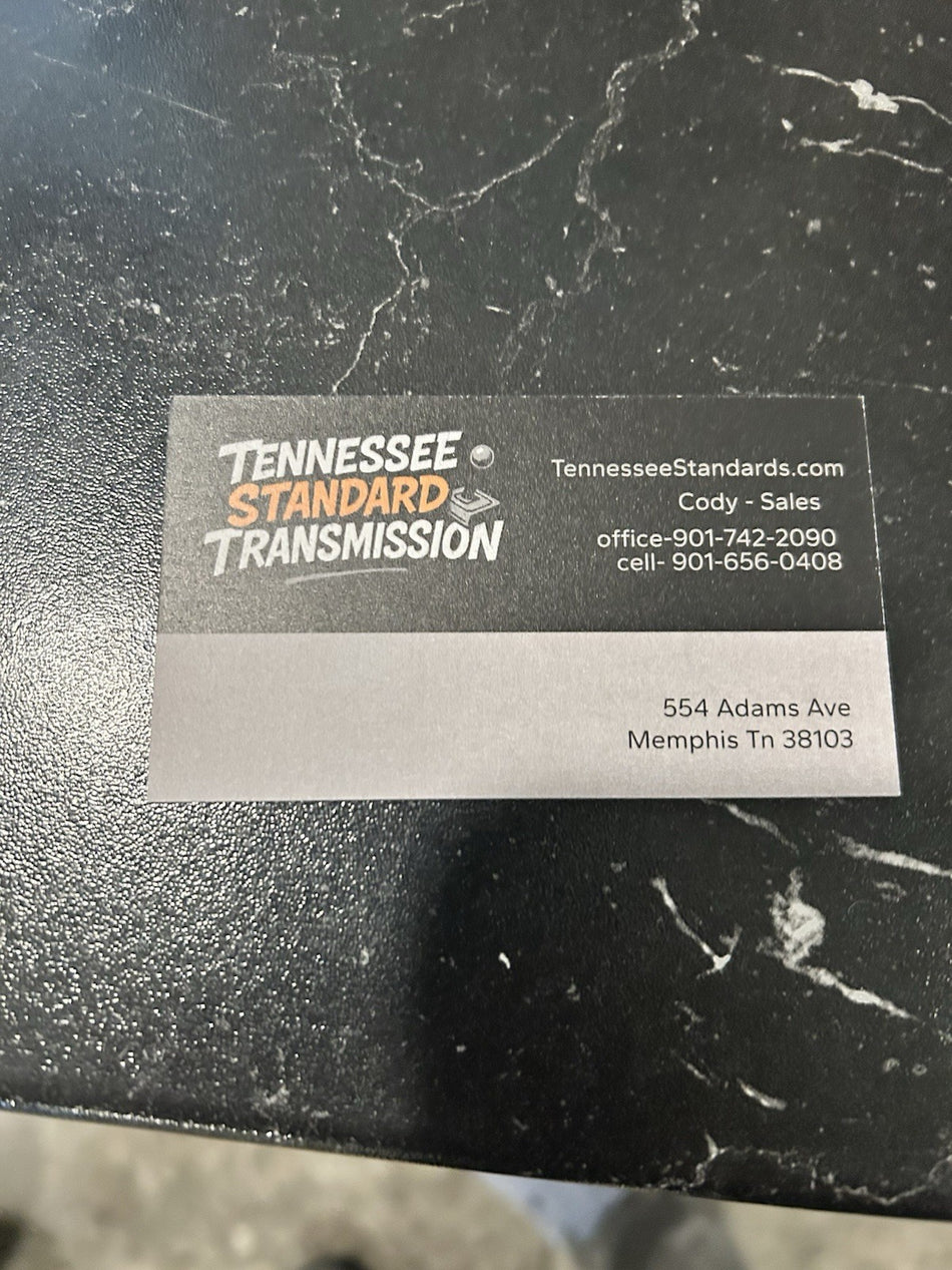 Business card for Tennessee Standard Transmission showcasing contact details and services.