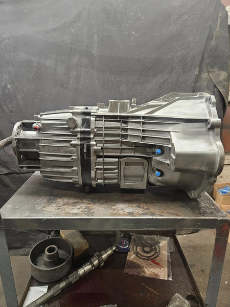 ZF 6 SPD manual transmission on a workstation, showcasing quality craftsmanship and testing readiness.