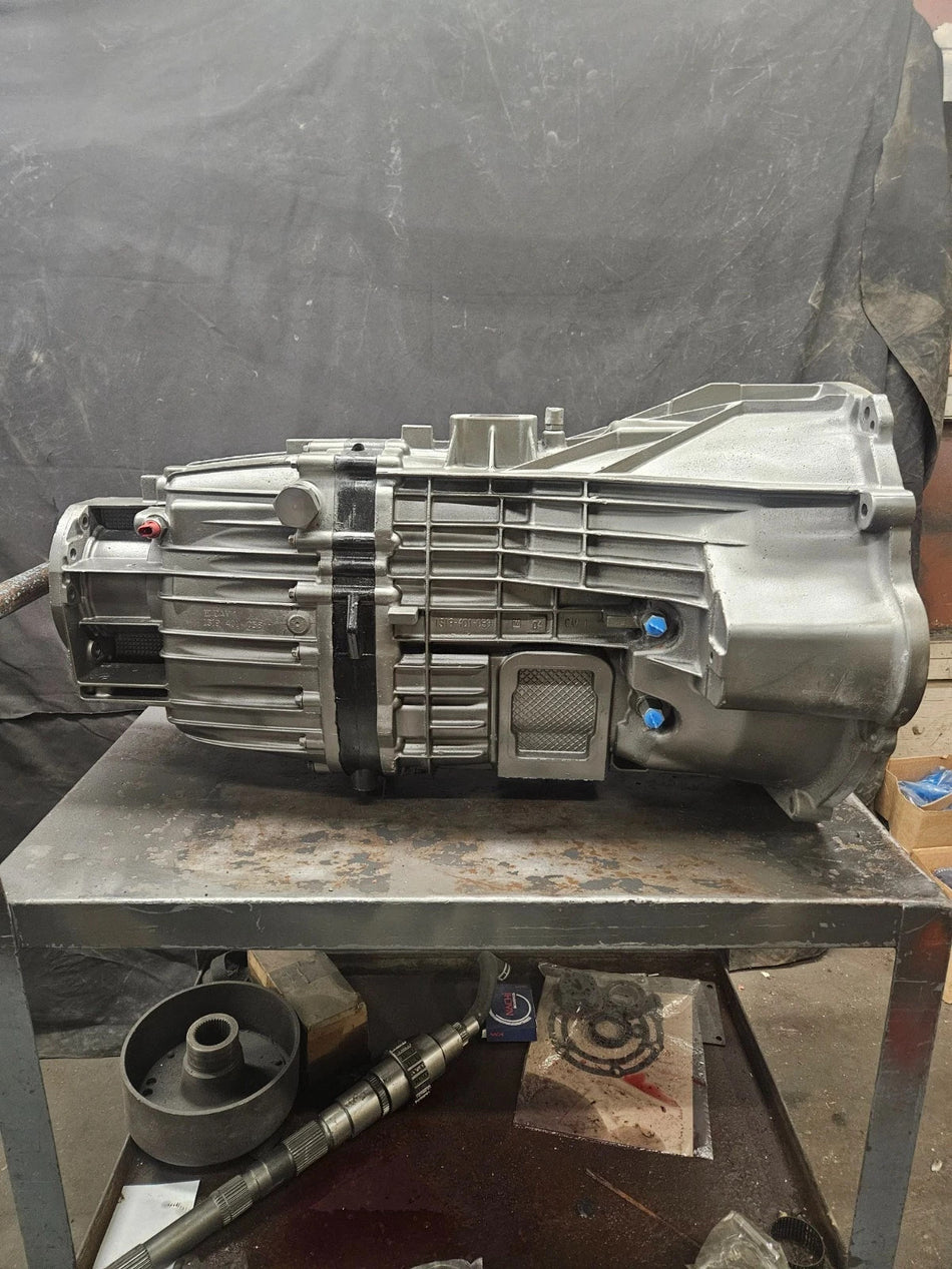 ZF 6 SPD manual transmission on a workstation, showcasing quality craftsmanship and testing readiness.