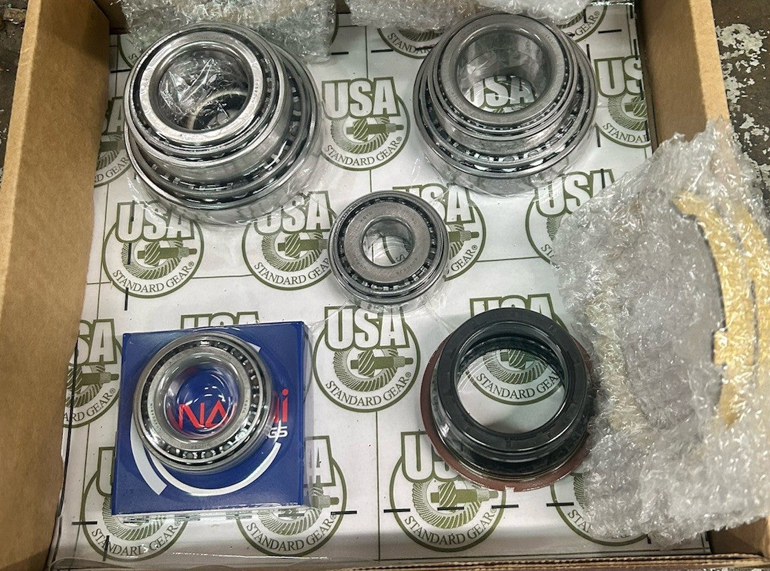 NV5600 Bearing Kit in a box, featuring various new bearings and seals for NV5600 transmission maintenance.