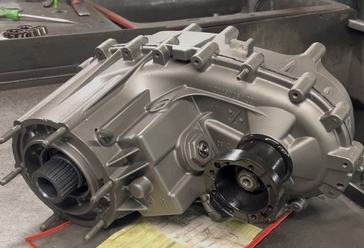 NP231J Transfer Case 87-95 showing a quality checked and dyno tested design in silver finish.