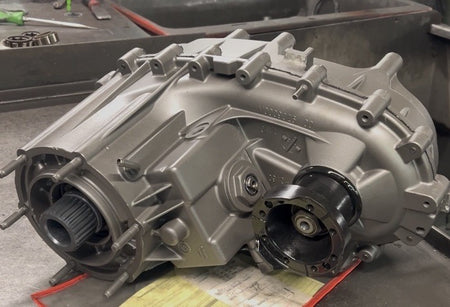 NP231J Transfer Case 87-95 showing a quality checked and dyno tested design in silver finish.