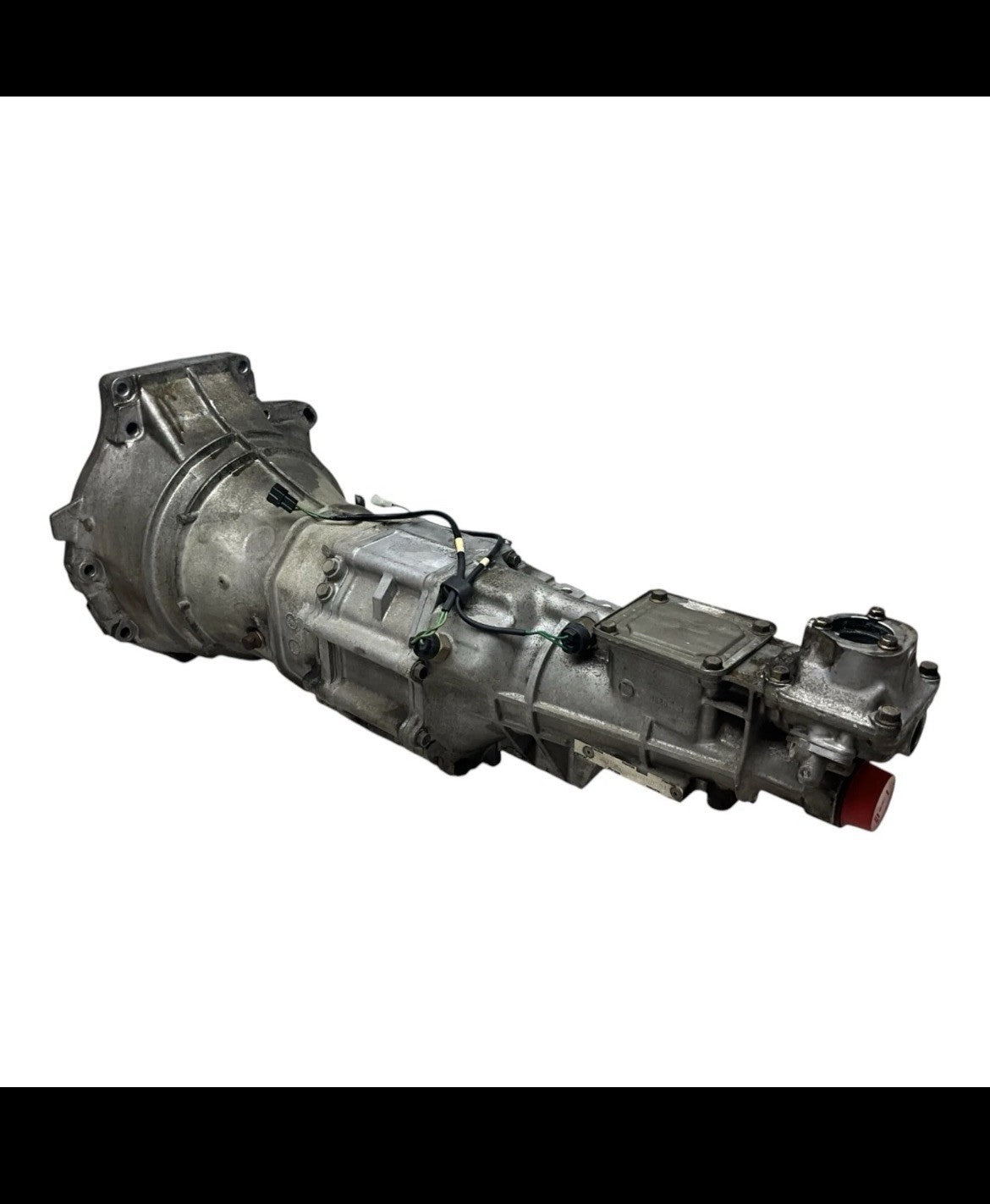 1999-2005 NB Mazda Miata Transmission, complete unit showcasing assembly and connectors.