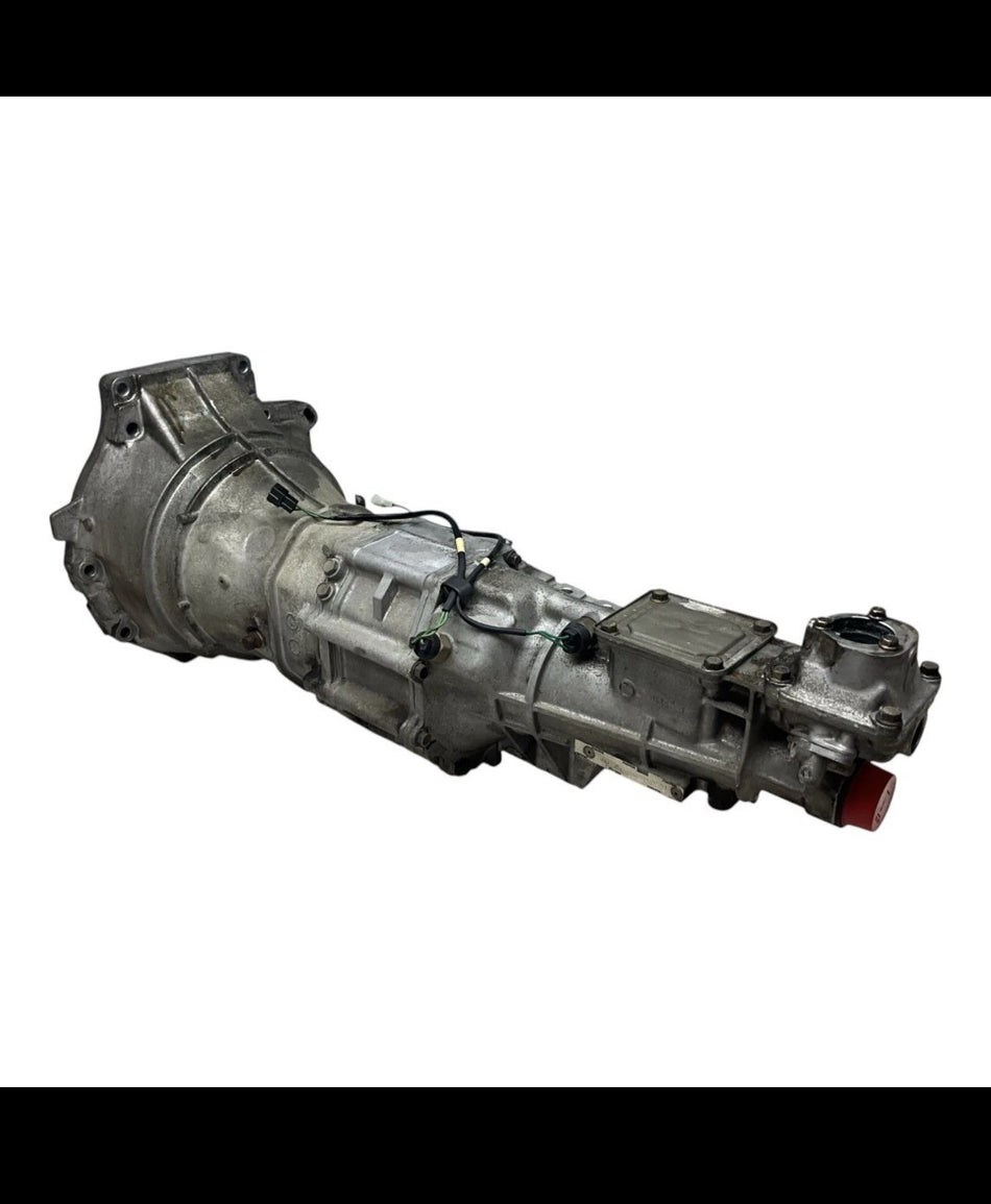1999-2005 NB Mazda Miata Transmission, complete unit showcasing assembly and connectors.