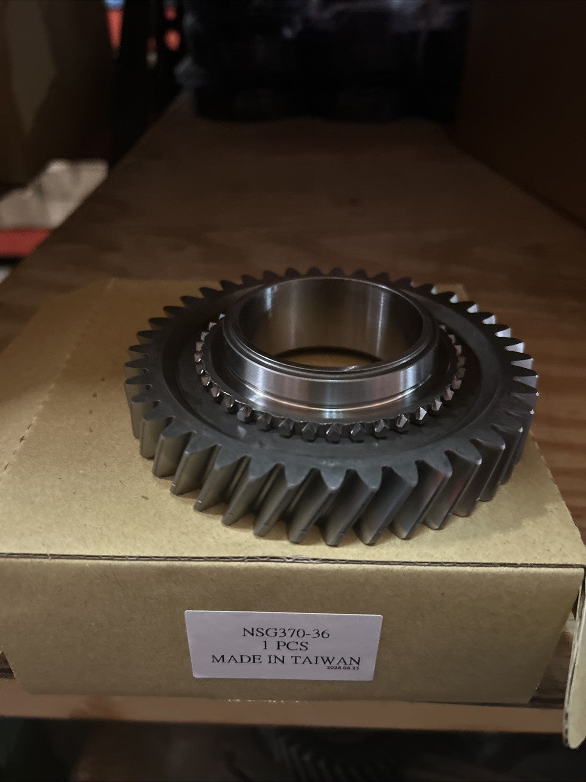 NSG370 REVERSE GEAR displayed on packaging, showcasing the gear's durable design and precise engineering.