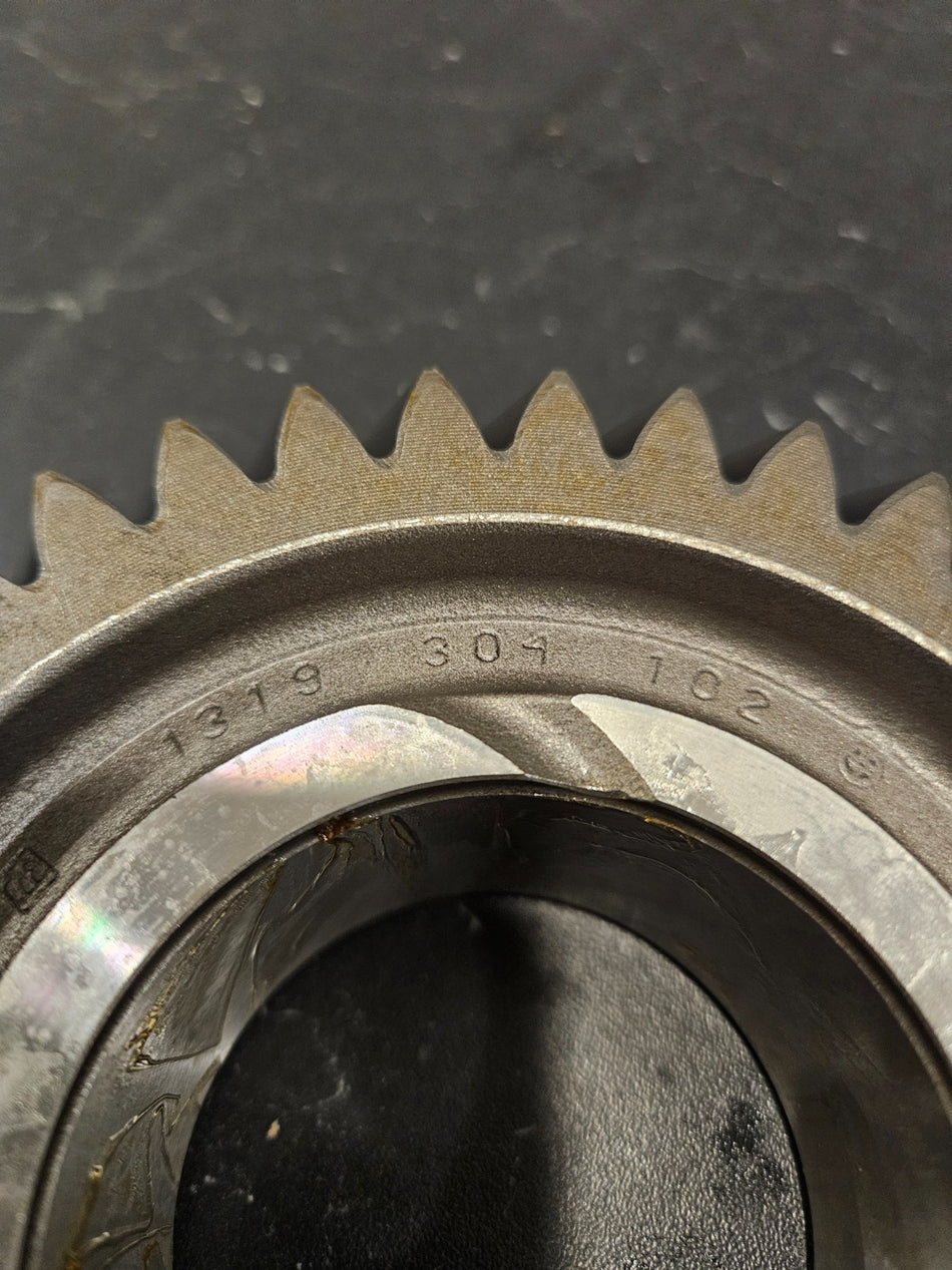 ZF S6-750 high torque gear 37T close-up showing detailed teeth and part numbers.