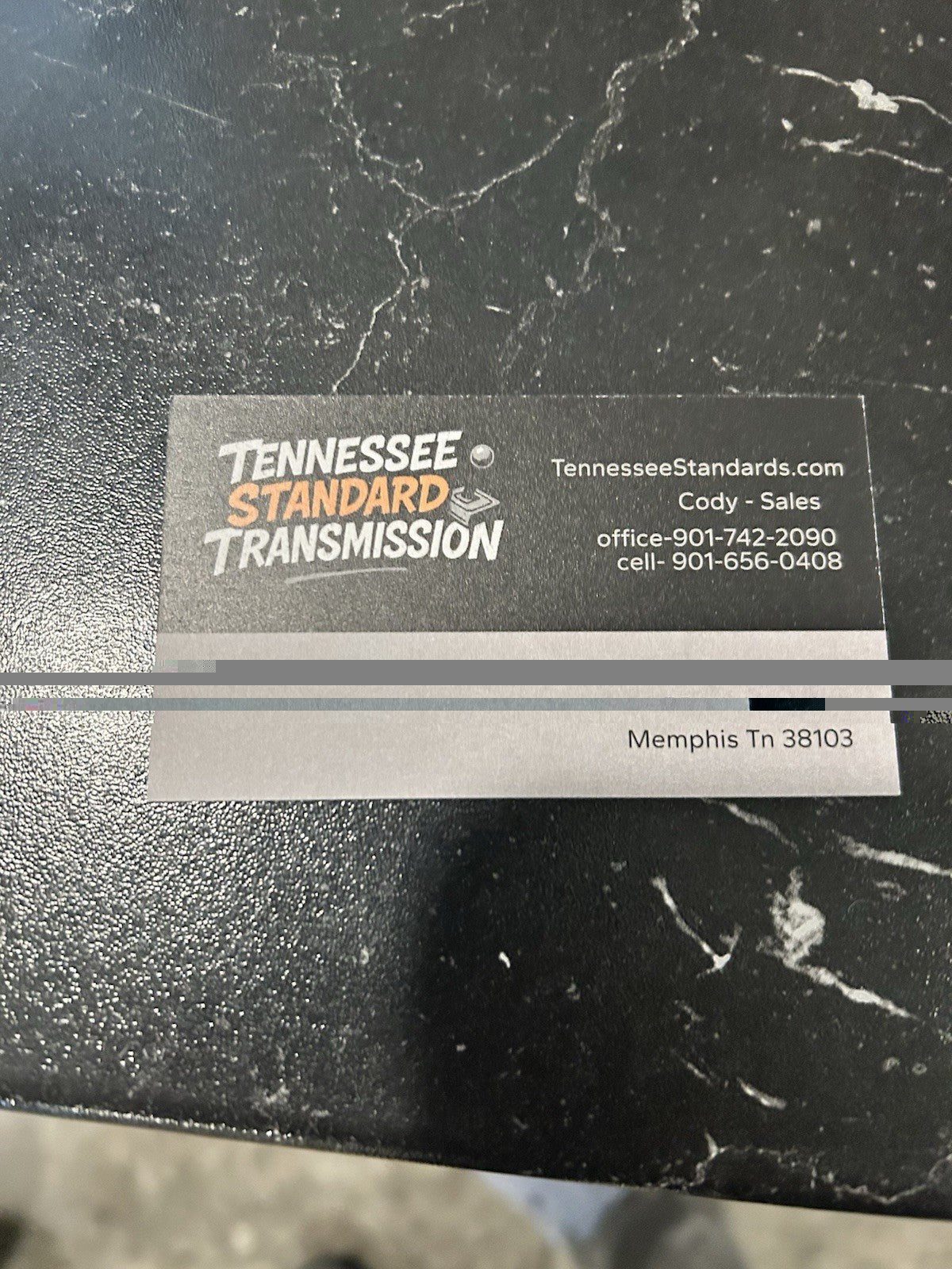 Business card for Tennessee Standard Transmission with contact information.
