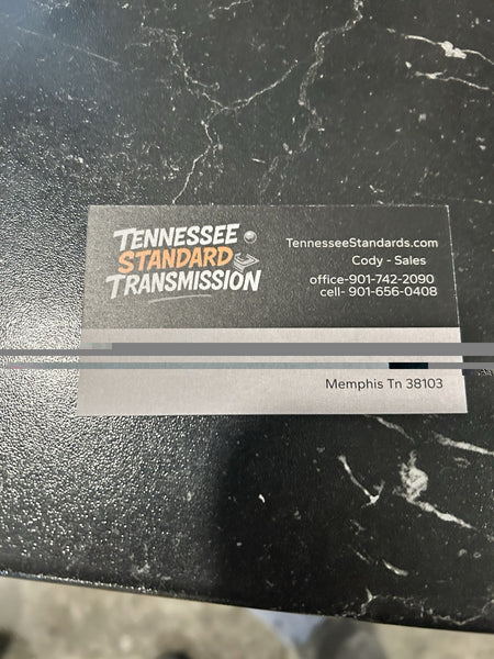 Business card for Tennessee Standard Transmission with contact information.