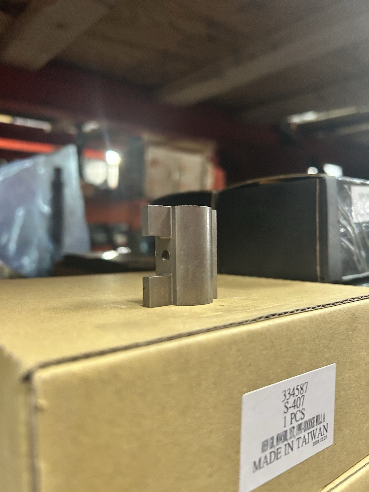 NV4500 3-4 Shift Lug displayed on a box, featuring a distinct metal structure for transmission rail component.
