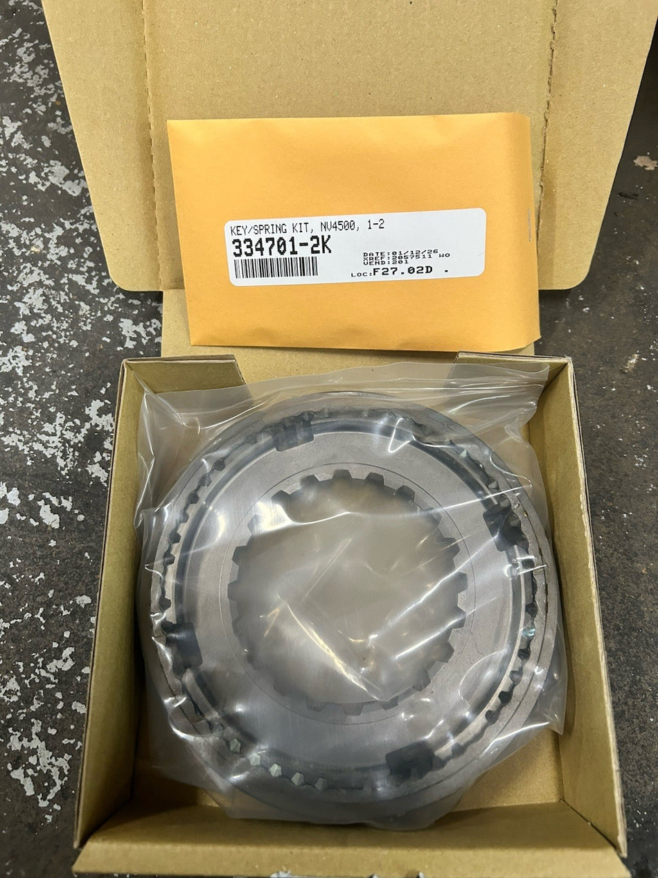 NV4500 1-2 Synchro Assembly With Keys And Springs inside packaging, showing individual components clearly.