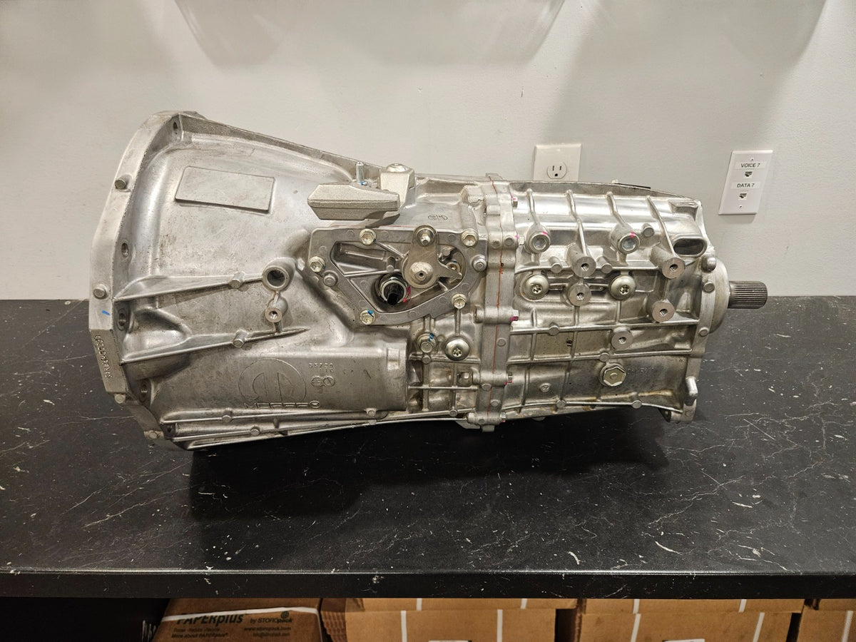 AL6 '18-'23 Jeep 3.6L manual transmission replacement shown from the side on a black countertop.