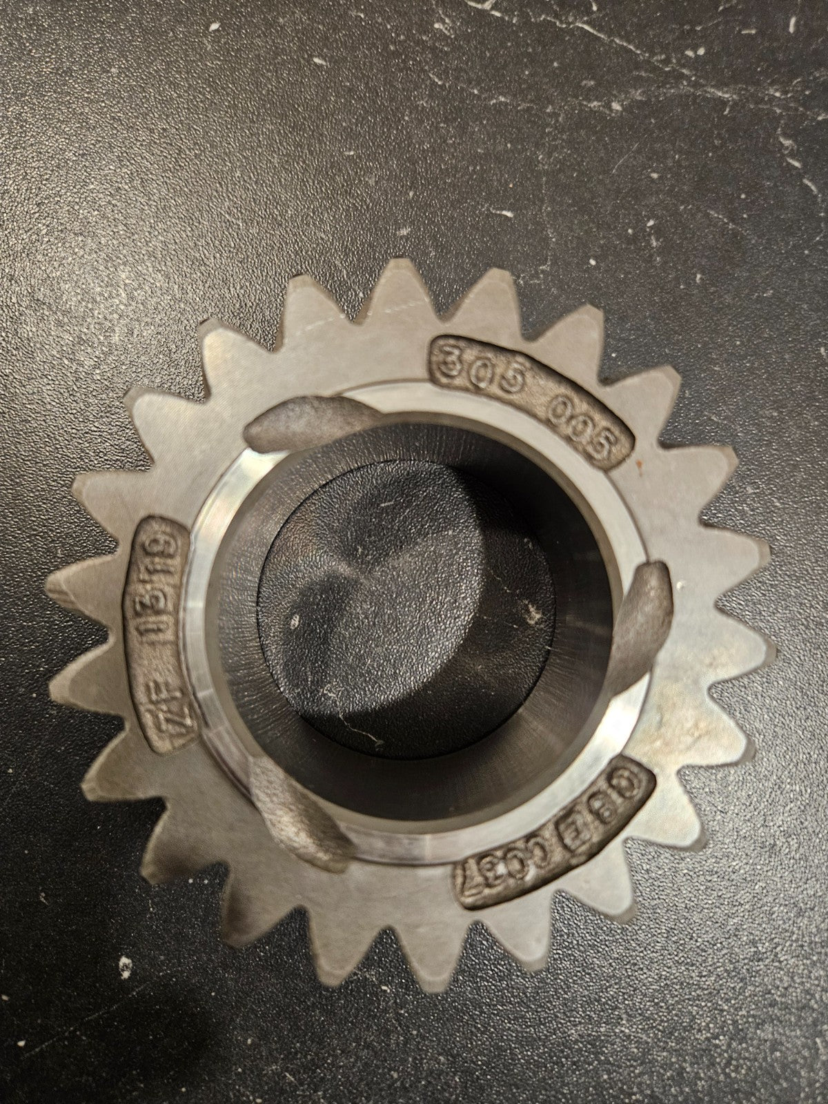ZF S6-650 reverse idler gear 22T shown from above with visible teeth and internal hole.