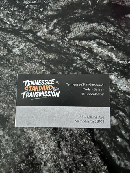 Business card for Tennessee Standard Transmission featuring contact information and logo.