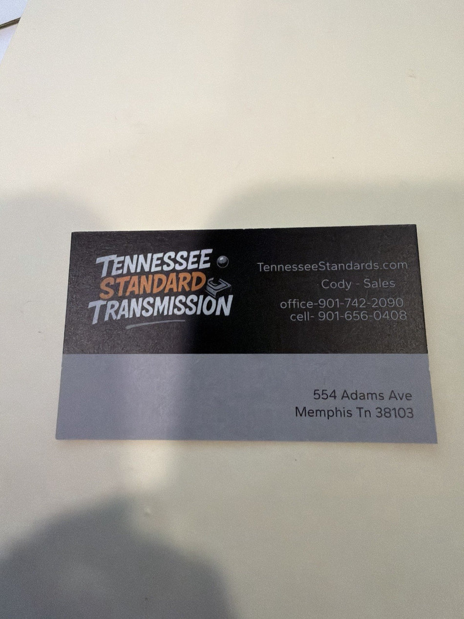 Business card of Tennessee Standard Transmission featuring contact information and location.