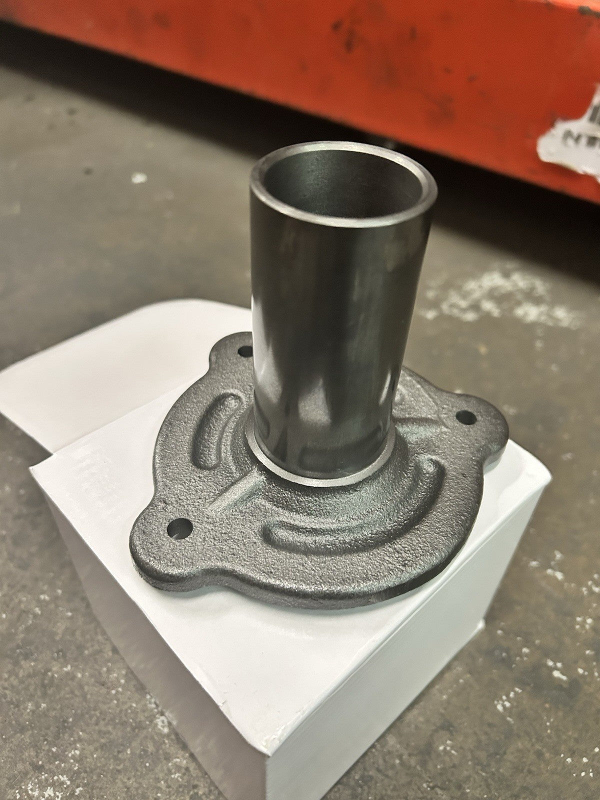 G56 Bearing Retainer showing metal construction with a cylindrical opening and a detailed base design.