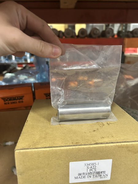 Nv4500 Reverse Idler Pin in packaging, displayed on a box for visibility, showing product details and clean design.