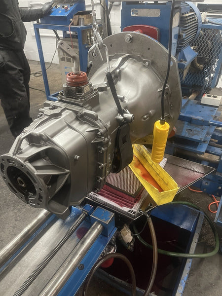 G56 manual transmission for Dodge RAM being prepared for inspection in a workshop setting.