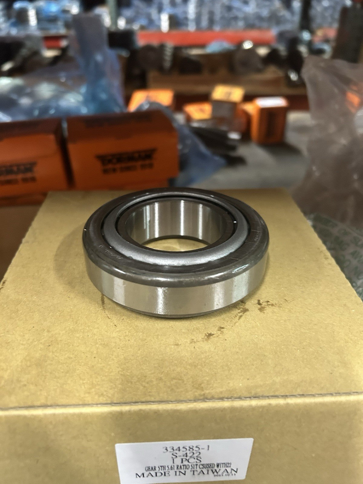 Nv4500 Rear Mainshaft Bearing displayed on a box, highlighting its sturdy design for reliable performance.