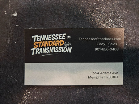 Business card for Tennessee Standard Transmission detailing services and contact information.