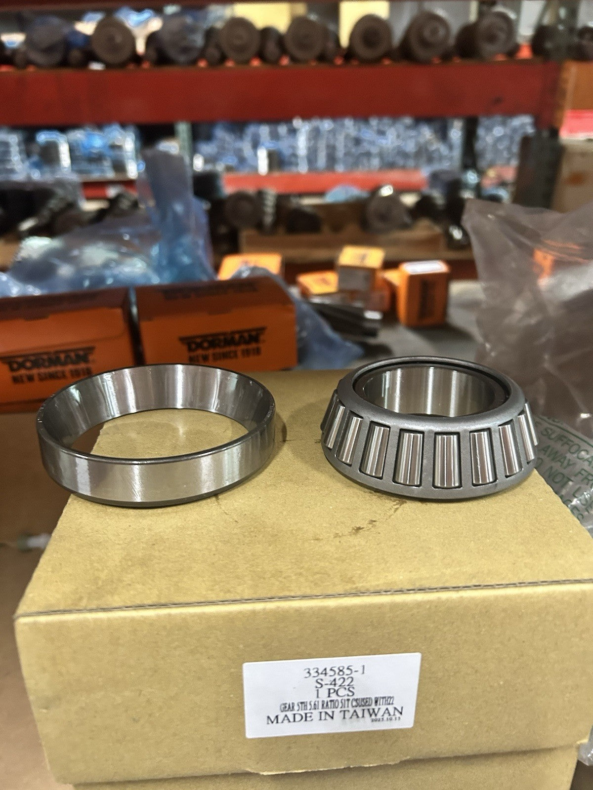 Nv4500 Rear Mainshaft Bearing components on a cardboard box, showcasing the bearing assembly.