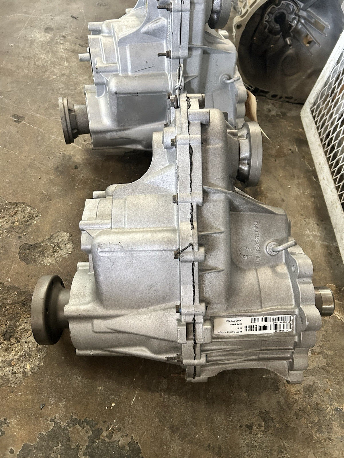 MP2010 transfer case warranty unit displayed in workshop, highlighting quality and testing features.