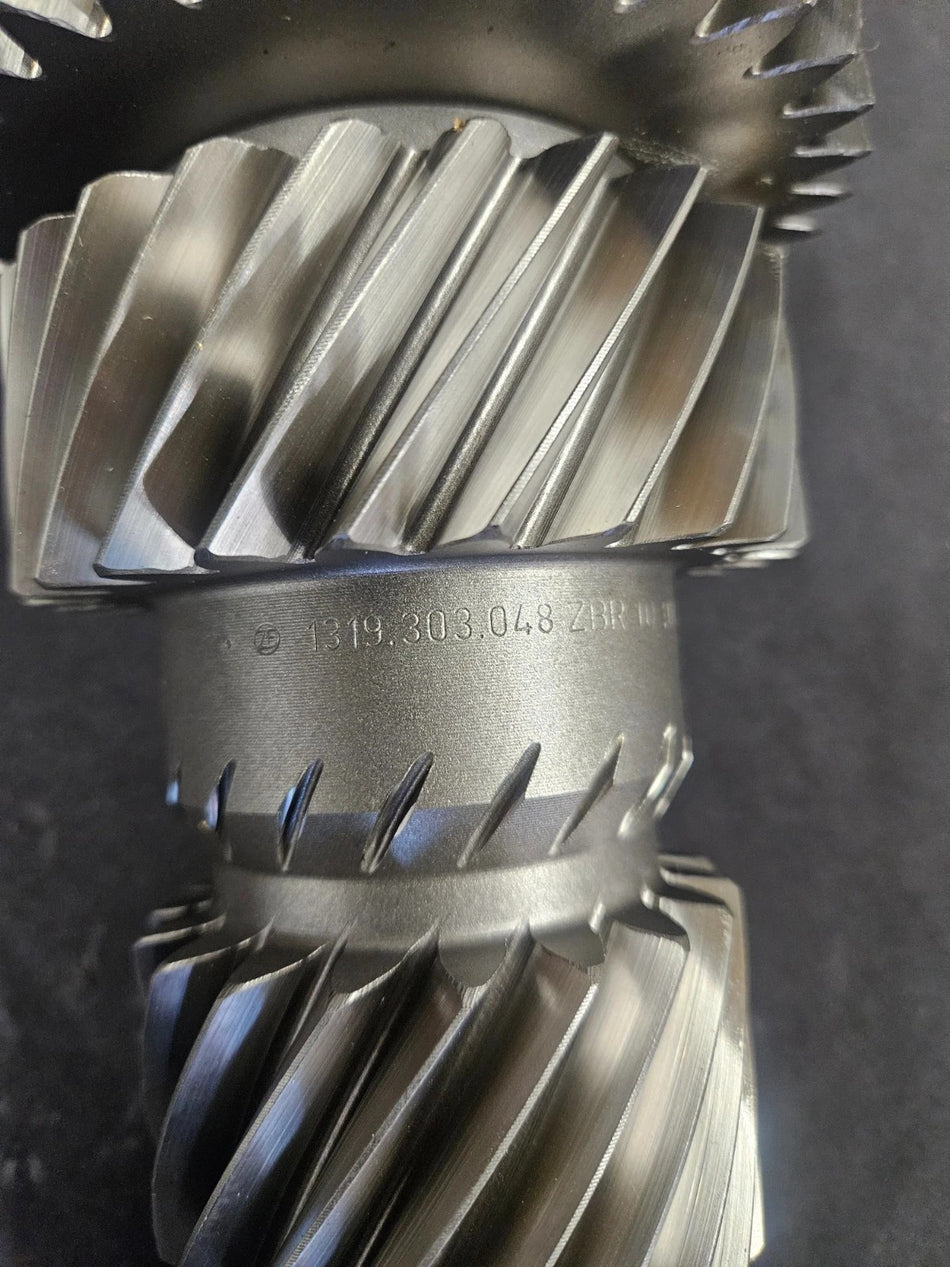 ZF S6-650 countershaft showing detailed gear teeth and manufacturer's markings on a metallic surface.