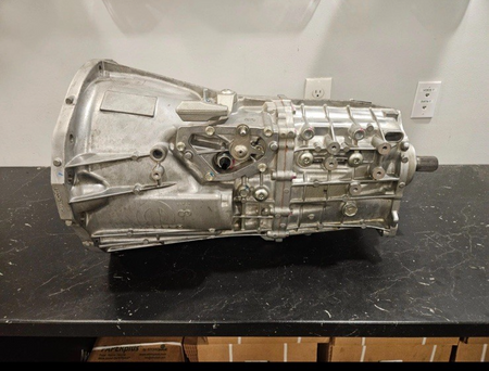 18-'23 Jeep Wrangler 6 Speed Manual Transmission side view, showcasing complete assembly and detail.