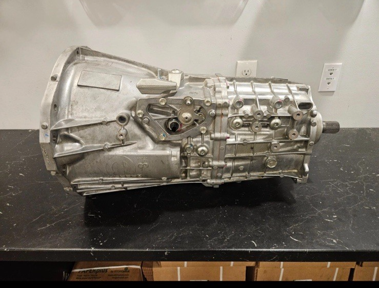 18-'23 Jeep Wrangler 6 Speed Manual Transmission side view, showcasing complete assembly and detail.