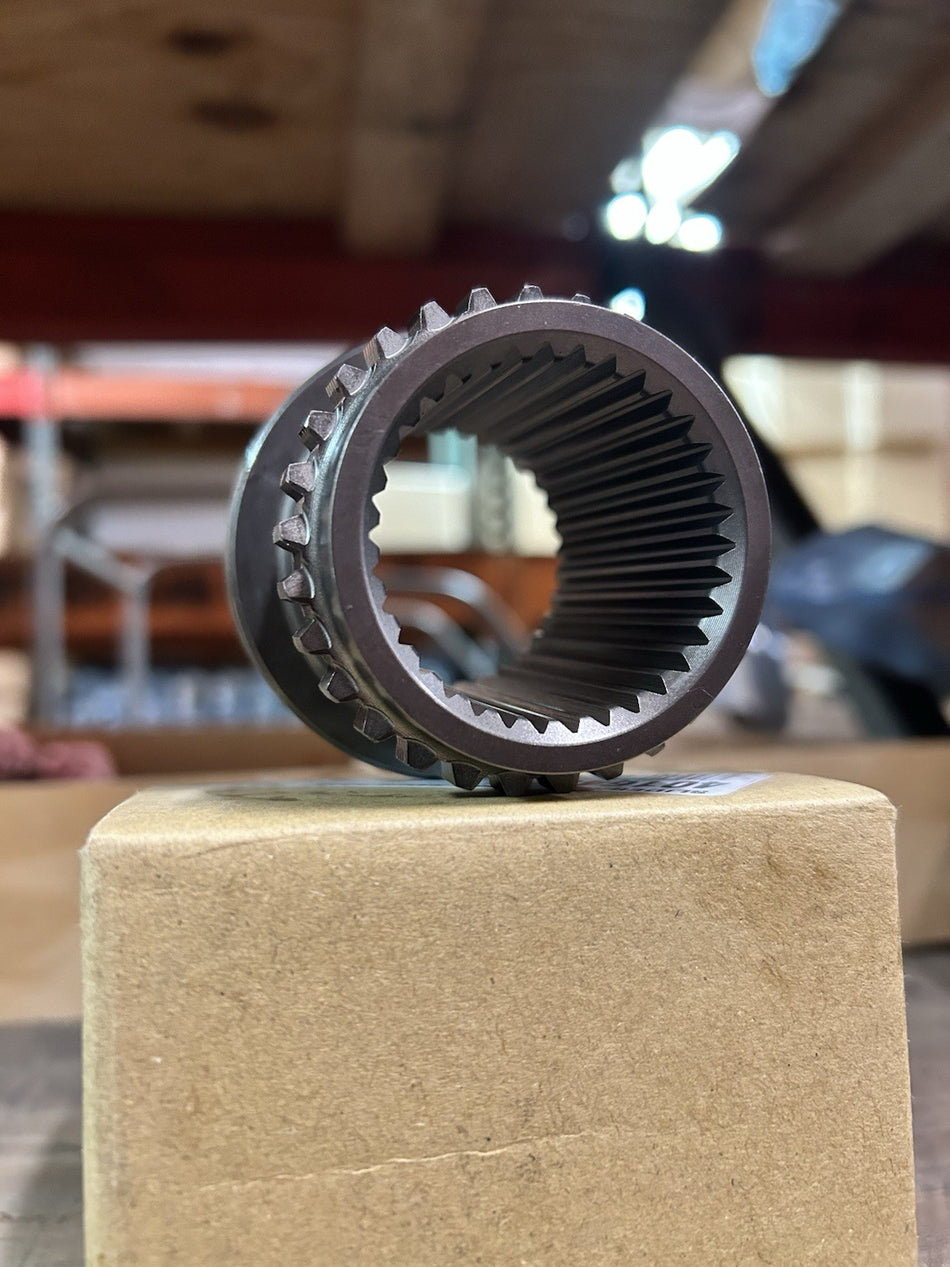 NP261 Slider/Hub Range 0.318 gear showing internal splines on a cardboard surface.